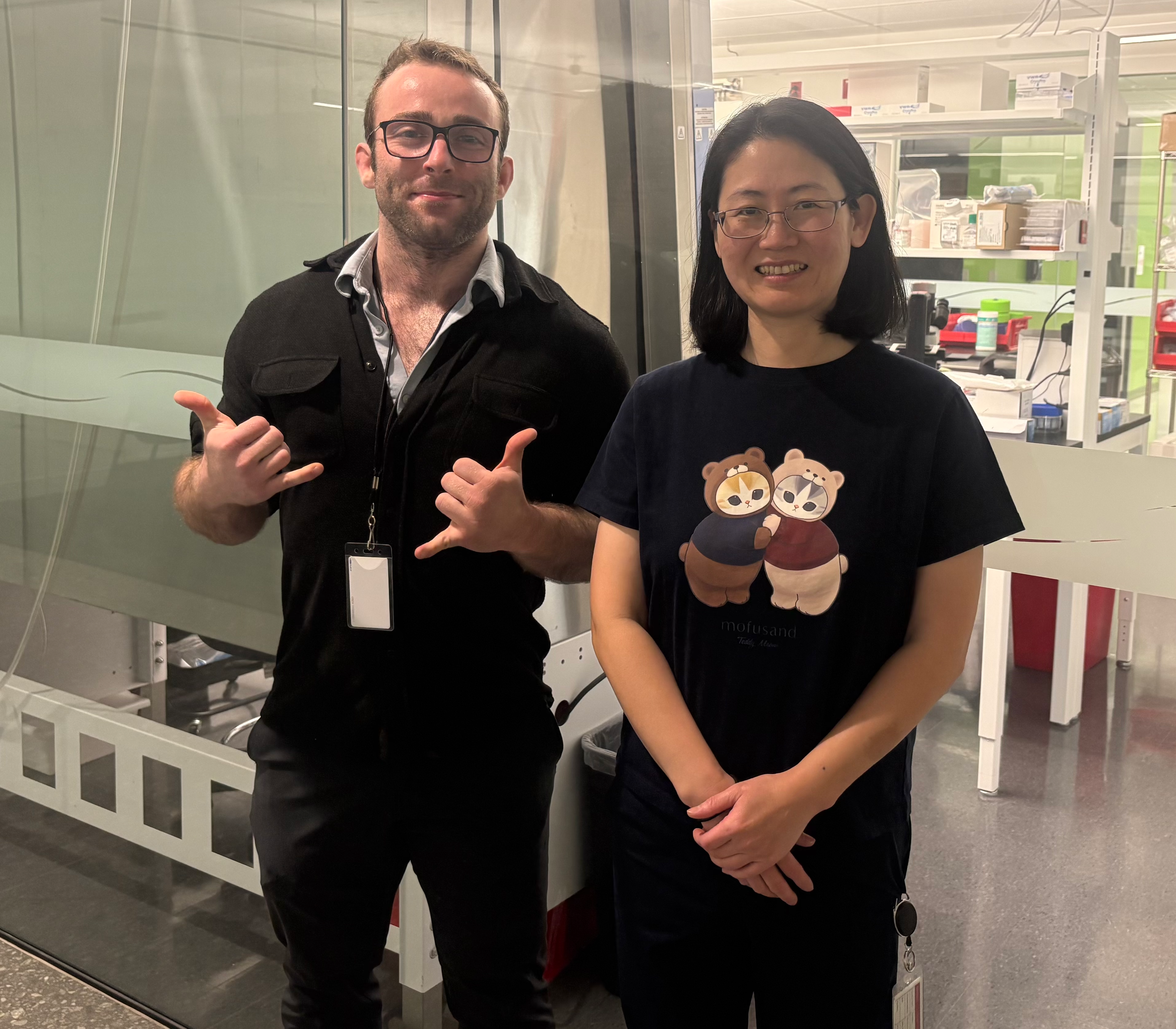 Two people standing together in a laboratory.